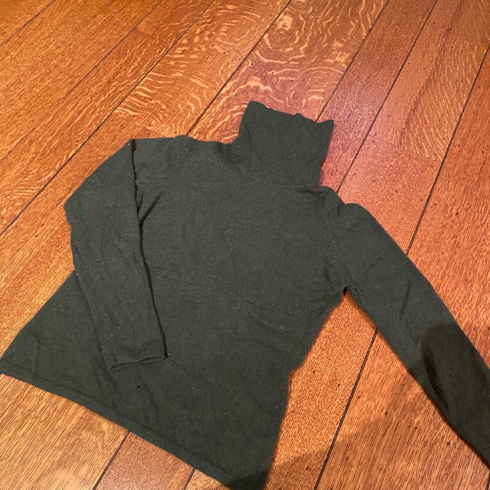 100% cashmere turtleneck.